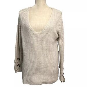 The Impeccable Pig Sweater V-neck Ivory Grommet Sleeve lace-up detail